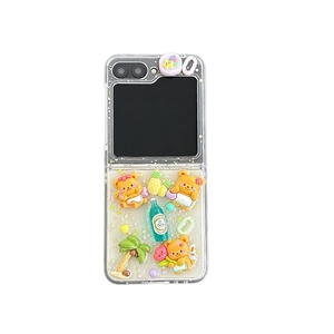 Cute 3D yellow bear and tropical fruit charms on a clear foldable phone case