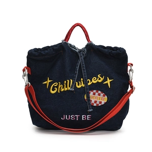 Denim tote bag with Chill Vibes embroidery, red handles and adjustable shoulder strap