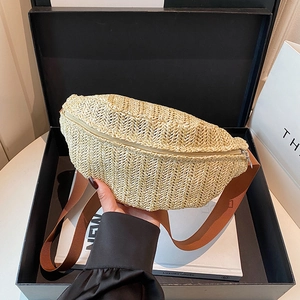 Fashionable beige woven crossbody chest bag with brown wide strap in a luxury gift box