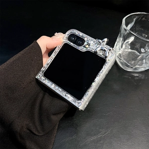 Close-up of sparkling rhinestone phone case with silver balloon dog charm for Samsung Z Flip