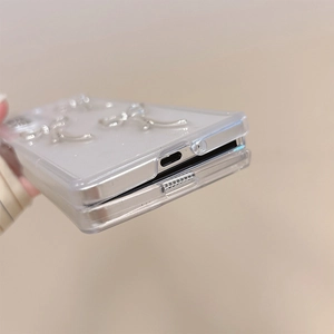 Macro view showing precise charging port cutouts of transparent glitter Z Flip 6 case