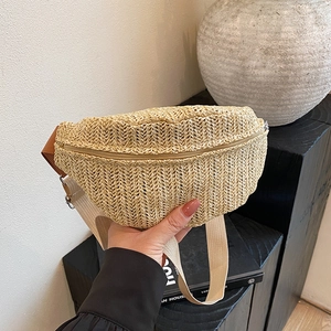Handwoven beige straw crossbody chest bag with V-shaped crochet texture and zipper