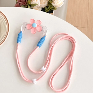 Close-up of the pink flower phone clip and adjustable braided crossbody lanyard