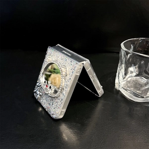 Close-up of sparkling sequin Galaxy Z Flip case with integrated mirror and silver balloon dog