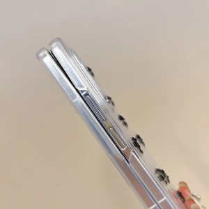 Detail view of transparent flip phone case showing precise cutouts and 3D flower decoration