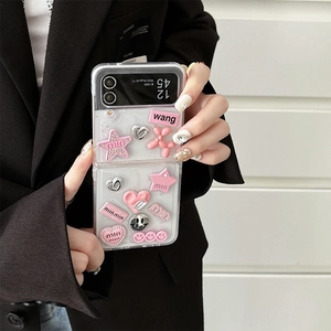 Detail of pink and silver 3D heart and dog charms on a clear Galaxy Z Flip case