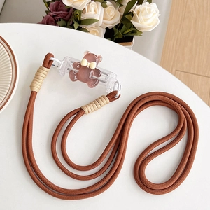 Close-up of a brown braided phone lanyard with a cute resin bear charm detail.