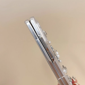 Detail of transparent Galaxy Z Fold case with elegant pearl and glitter star embellishments