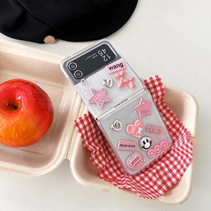Detail of pink 3D dog and heart accessories on a clear phone case for Samsung Z Flip