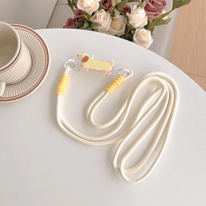 Close-up of a white braided phone lanyard with a yellow cartoon dachshund clip and decor