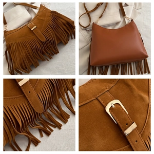 Brown suede shoulder bag detail showing fringe tassels and adjustable gold buckle strap