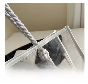 Close-up of white woven cotton handles and PVC edge piping on the iridescent tote bag
