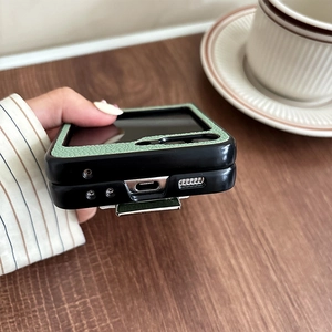 Detail of Galaxy Z Flip case with green leather texture and precise charging port cutouts