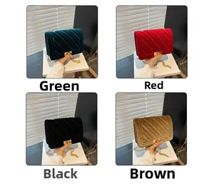 Macro shot of quilted velvet shoulder bags in green, red, black, and brown with gold locks