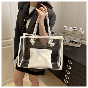 Detail of transparent PVC tote bag with white cotton rope handles and interior pouch