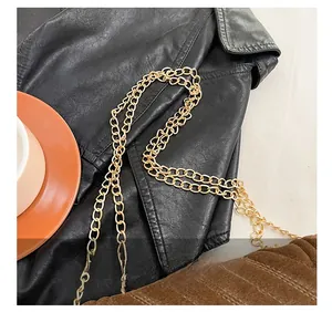 Close-up of brown quilted bag with gold chain strap and comfortable shoulder design