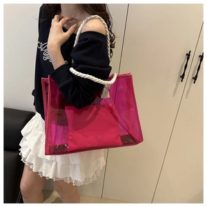 Detail of rose pink transparent PVC tote bag with thick cotton rope handles and inner pouch
