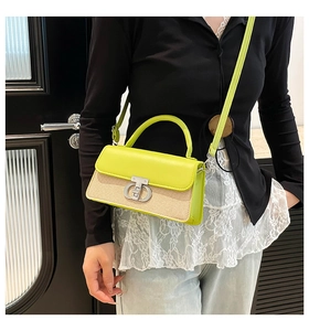 Fashionable lime green and straw small square bag shown as a crossbody on a model