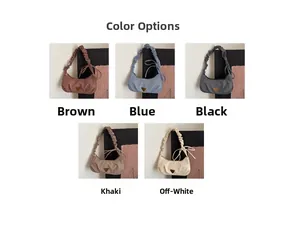 Detail showing various colors of ruched cloud bags with triangle metal logo plates