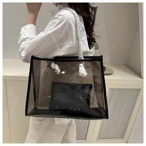 Black semi-transparent tote bag with white woven rope handles and inner pouch detail