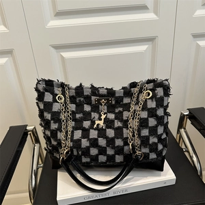 Modern black and white plaid denim tote bag with chain handles and deer charm pendant