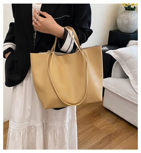 Large mustard yellow tote bag shown on model for a stylish daily office commute look