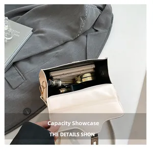 Interior view showing capacity for a smartphone, perfume, and cosmetics in a cream flap bag