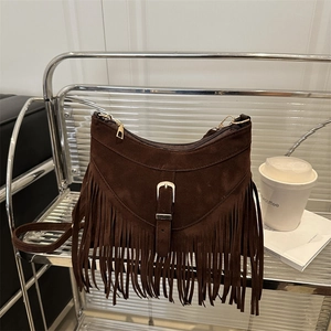Retro dark brown matte suede crossbody bag with long tassel fringe and gold buckle decor
