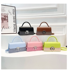 Minimalist crossbody handbags collection in five colors on a curved display stand