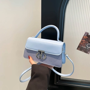 Elegant light blue contrast color crossbody bag with silver buckle and leather strap