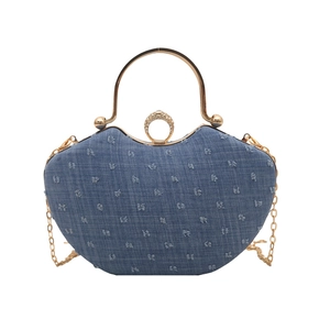 Vintage denim handbag with rhinestone ring buckle and gold chain strap on white background