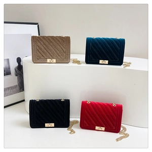 Detailed display of velvet crossbody bags in four colors with quilted texture and gold chain
