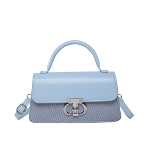 Classic sky blue crossbody bag featuring a contrast texture flap and silver T-lock closure