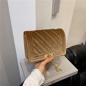 Chic brown velvet crossbody bag with V-shaped quilting and gold metal chain strap