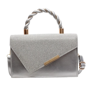 Elegant silver crossbody bag with gold twisted handle and glitter envelope flap cover