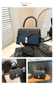 Detail of black glitter flap on vintage crossbody bag with gold metal square buckle
