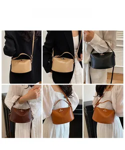 Detail view of four textured leather bucket bags with adjustable straps and metal locks