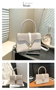 Detailed macro view of khaki leather handbag with sparkling rhinestones and golden square lock