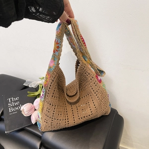 Bohemian crochet hobo bag with colorful floral embroidery and brown knit mesh structure
