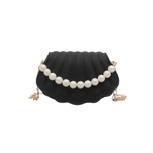 Elegant black shell-shaped crossbody bag with pearl decoration and gold chain strap