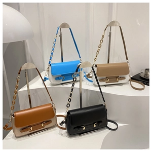 Multiple stylish flap crossbody bags in various colors displayed on white pedestals