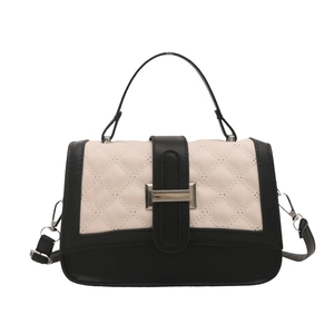 Minimalist quilted crossbody bag in black and white with metal buckle and shoulder strap