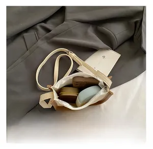 Interior view showing the storage capacity of the cream and brown contrast shoulder bag