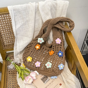 Large hand-woven brown tote bag with colorful 3D floral accents and hollow-out design