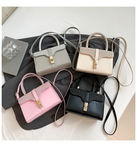 Macro shot of stylish crossbody bags in grey, white, pink and black with glitter texture