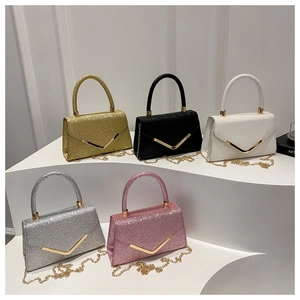 Five elegant sequin evening bags in assorted colors with V-shaped gold metal clasps