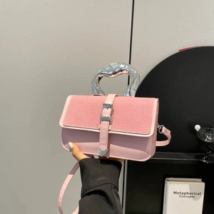 Pink minimalist handbag with silver metal handle and contrast stitching textures