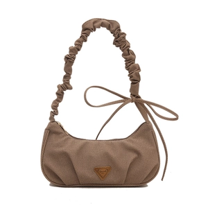 Brown ruched cloud shoulder bag with pleated strap and bow detail on white background