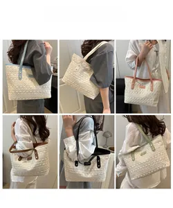 Detail showing various color options and geometric woven texture of the straw tote bag