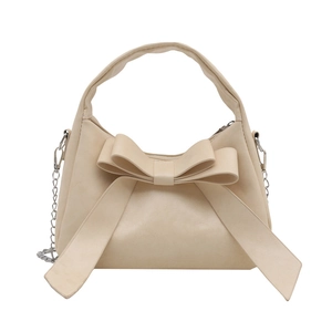 Sac à main élégant crème avec nœud et bandoulière chaîne argentée pour femme, style été 2025